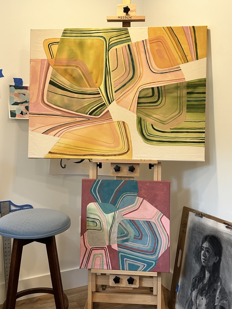 Two paintings on easels in Julia's studio